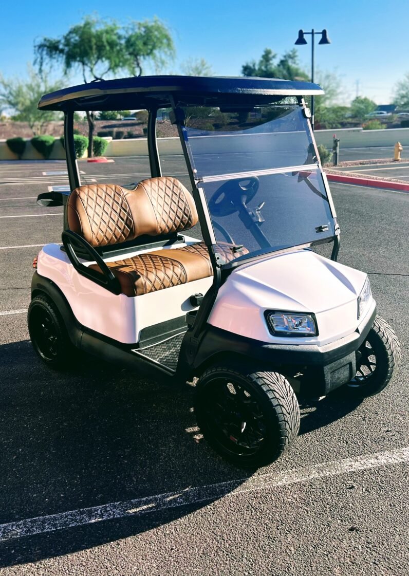 A sleek 2019 Club Car Tempo in white, showcasing its premium design and features, ideal for golf or neighborhood cruising.