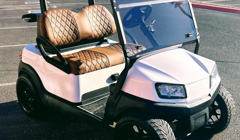 A sleek 2019 Club Car Tempo in white, showcasing its premium design and features, ideal for golf or neighborhood cruising.